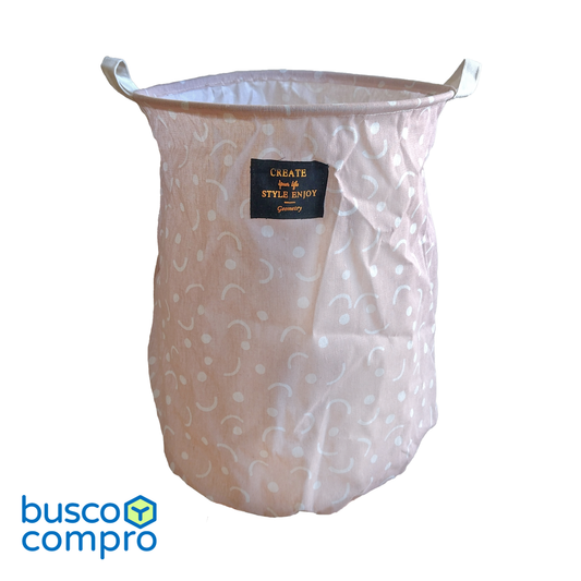 Cesto de tela color rosado, con figuras blancas